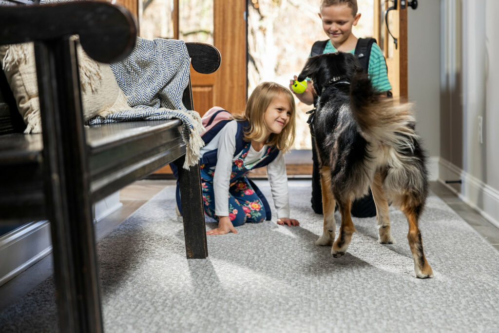 Kids playing with dog | Flooring and More